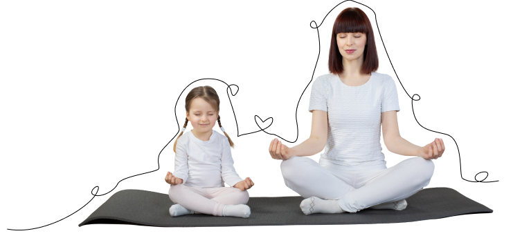 Une mère et sa fille assises sur un tapis, en posture de yoga.
